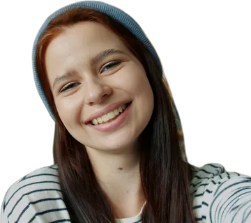 Young woman grinning as if keeping a secret